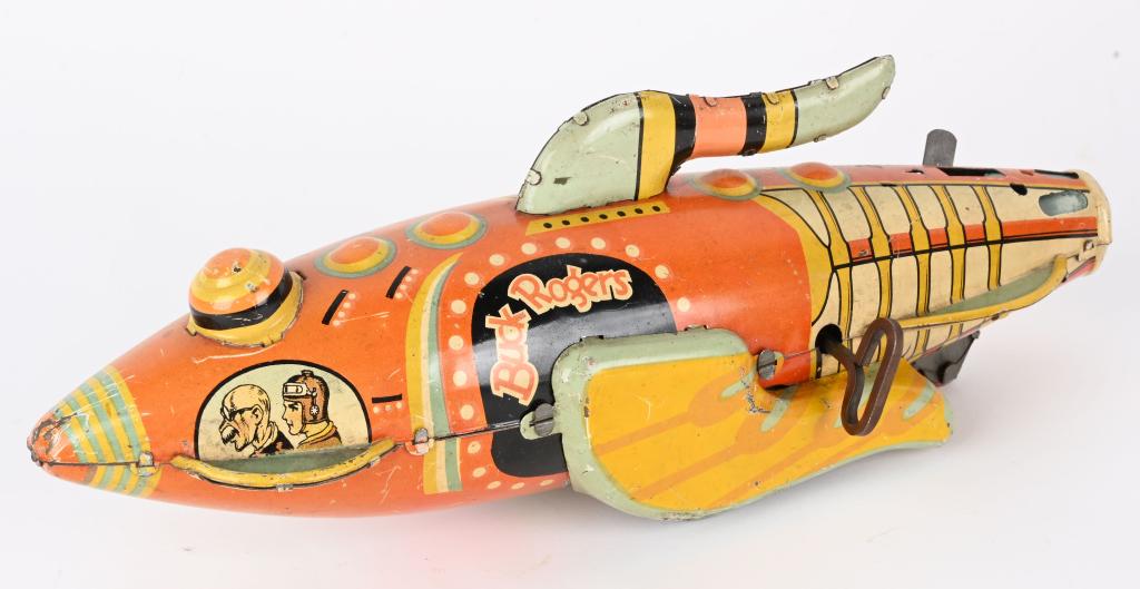 MARX TIN WINDUP BUCK ROGERS ROCKET SHIP: Marx tin windup Buck Rogers Rocket Ship. All original missing tail fin. Windup works. 12" Very Good-Excellent