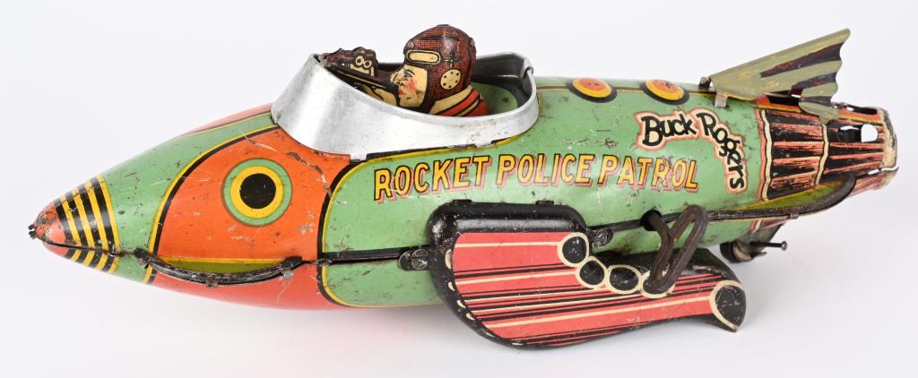 MARX TIN WINDUP BUCK ROGERS ROCKET POLICE PATROL: Marx tin windup Buck Rogers Rocket Police Patrol. Original toy with replaced tail fin. Windup works. 12" Very Good-Excellent