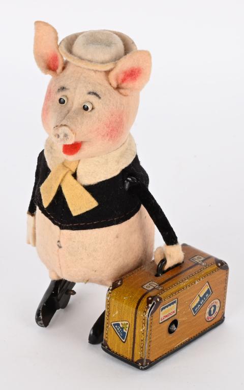 SCHUCO WINDUP WALT DISNEY PIG & SUITCASE (1 of 4)