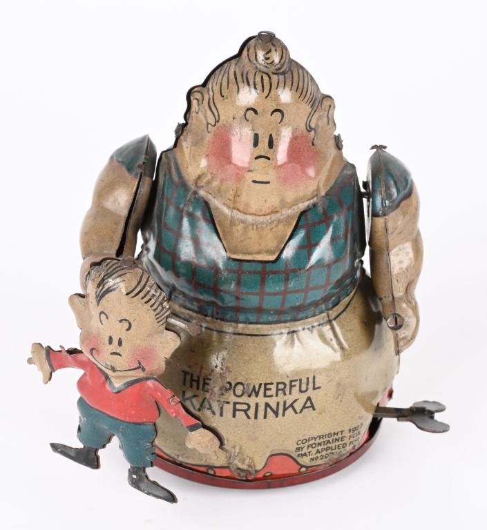 NIFTY TIN WINDUP POWERFUL KATRINKA & JIMMY (1 of 4)