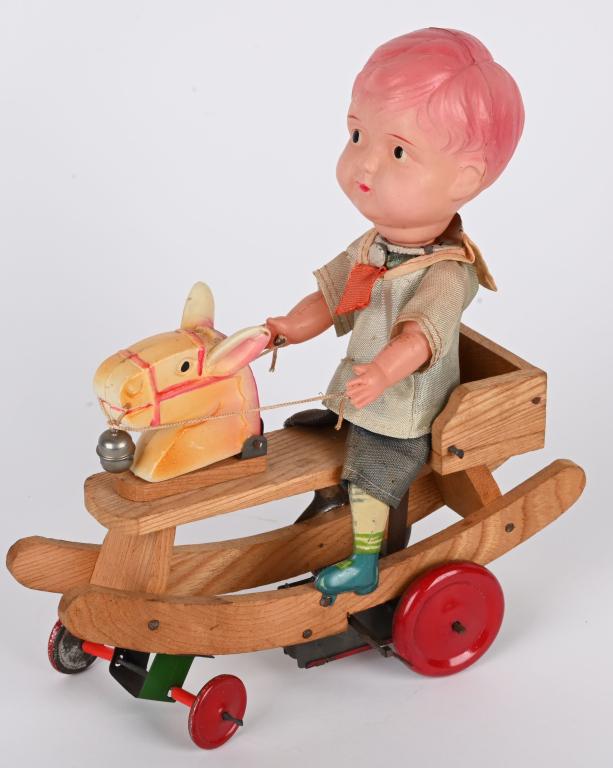 JAPAN CELLULOID WINDUP BOY RIDING HOBBY HORSE (1 of 5)