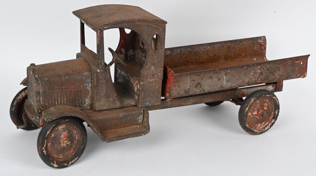SAMPSON PRESSED STEEL DUMP TRUCK: Gendron Sampson pressed steel Dump Truck. All original as found condition. Nice solid truck ready for restoration. Missing back gate. 27" Good