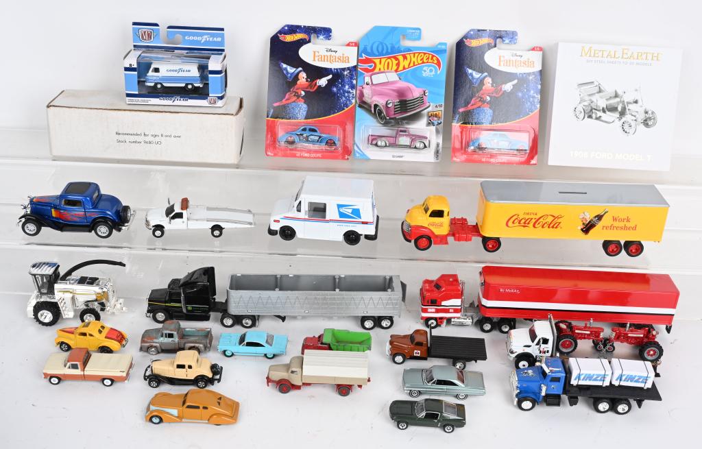 LARGE LOT OF DIECAST VEHICLES: Lot includes Coca Cola bank truck, Hot Wheels on cards, BJ McKay truck and trailer, U.S. Mail truck and many more. Condition varies. Largest is 11", Very Good-Excellent