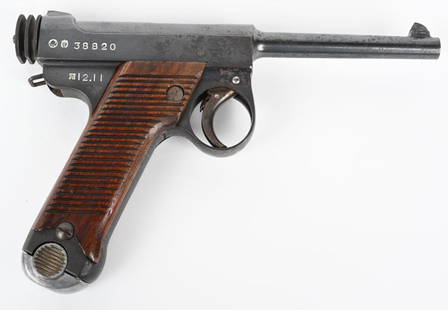 JAPANESE SMALL GUARD TYPE 14 NAMBU PISTOL: SERIAL NUMBER 38820 BARREL 4-5/8" CALIBER 8MM NAMBU MANUFACTURED 1937. Manufactured at Chuo Kogyo co. Ltd. Tokyo. Blue finish with 25 groove wood panel grips. Blade front sight. Grooved cocking knob