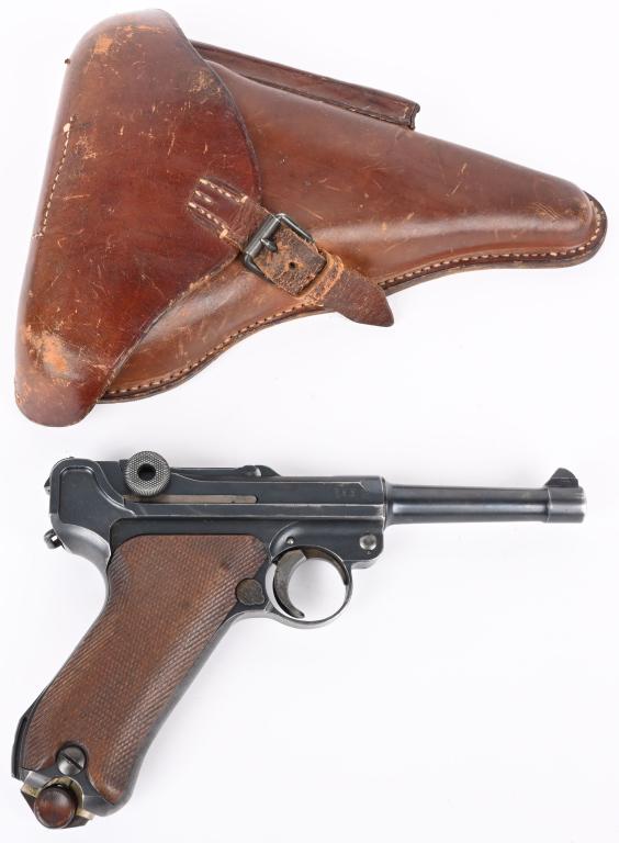 WW1 P-08 1917 LUGER PISTOL BY DWM WITH HOLSTER: SERIAL NUMBER 6502e BARREL 4" CALIBER 9MM (9x19) MANUFACTURED 1917. Produced during WW1 by DWM in 1917 for issue to German Military troops. Rust blue finish with checkered walnut grips with wood botto