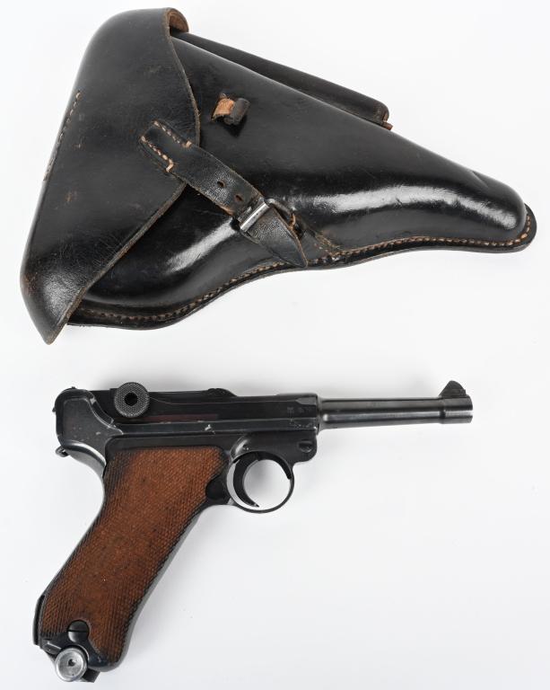 WW2 BYF41 CODE GERMAN LUGER RIG BY MAUSER: SERIAL NUMBER 2469q BARREL 4" CALIBER 9MM MANUFACTURED 1941. Produced by Mauser and marked with German code byf and dated 41. Eagle 655 inspected and finished in blue with full checkered walnut grips.
