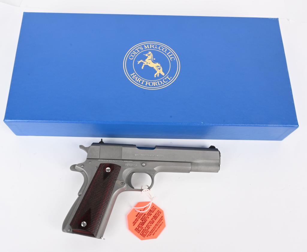 MIB COLT MK IV / SERIES 70 MODEL 1911 STAINLESS: SERIAL 72B3713. BARREL 5". CALIBER .45 ACP. All stainless Government full size 1911-A1 with diamond checkered rosewood grips, high wind drift rear sight as new in original box, liner, paperwork, two m