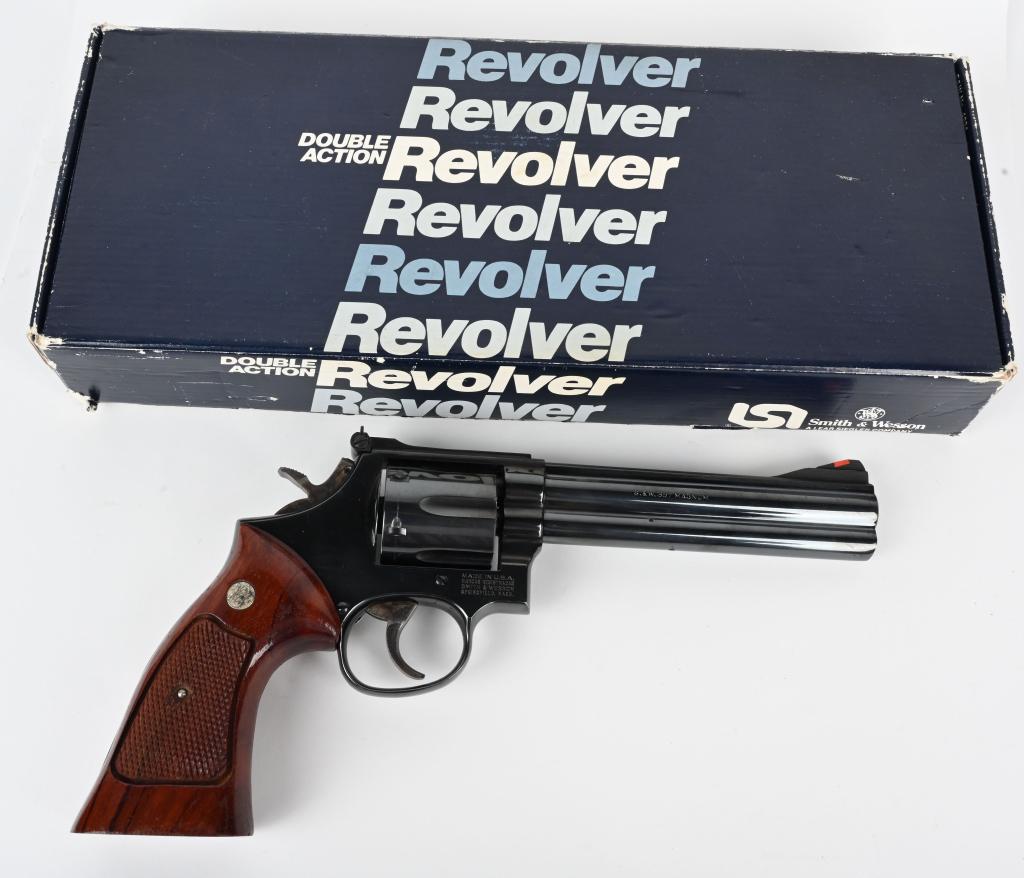 BOXED SMITH & WESSON MODEL 586 REVOLVER: SERIAL AFV5073. BARREL 6". CALIBER .357 MAGNUM. Referred to as the Distinguished Combat Magnum. Built on the square butt L frame features solid rib and lug, red insert front sight, target rear sight,