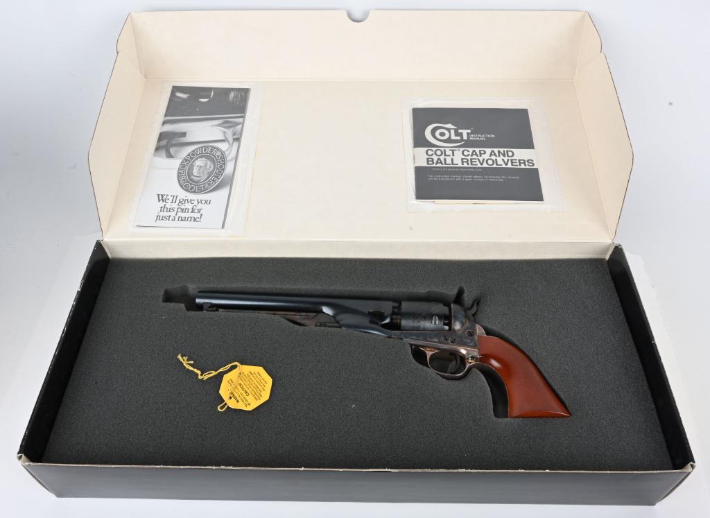 NIB COLT 2ND GEN. MODEL 1861 NAVY REVOLVER: SERIAL 40706. CALIBER .36. BARREL 7.5. Features blue and case finish with silver plated straps. Cylinder has Naval scene. Unfired in box with paperwork. A