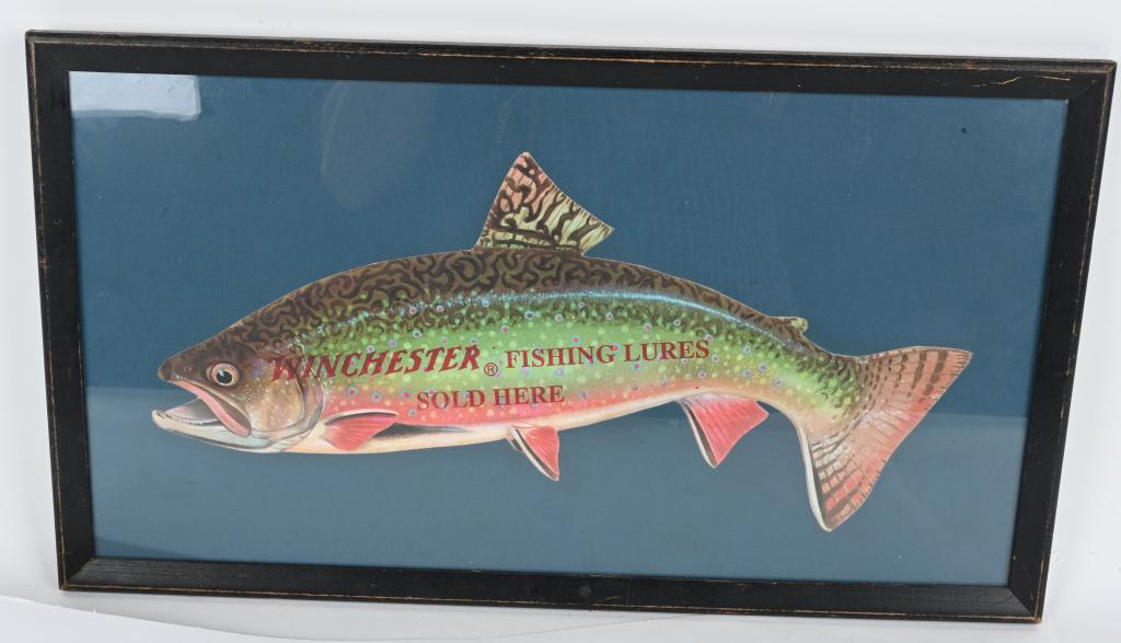 VINTAGE FRAMED WINCHESTER DIE CUT FISHING AD: Multi color light cardboard trout stamped "Winchester Fishing Lures Sold Here". Measures 17" in length and 7" tall in old original black frame with faded blue matte board. Piece is in excellent condit