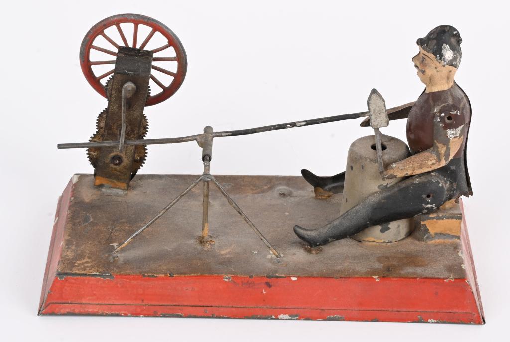 GERMAN TIN WINDUP MAN AT HAMMER MILL (1 of 4)