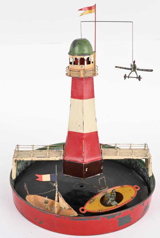 GERMAN TIN WINDUP LIGHTHOUSE GO ROUND (1 of 6)