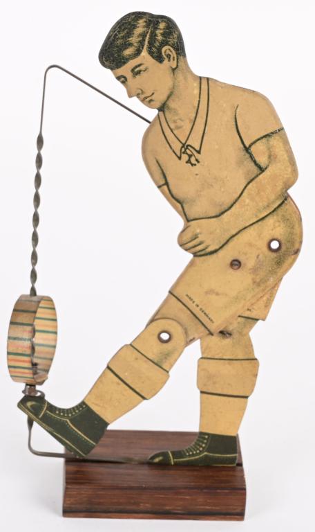 GERMAN TIN BOY KICKING SPINNER SQUEEZE TOY (1 of 2)