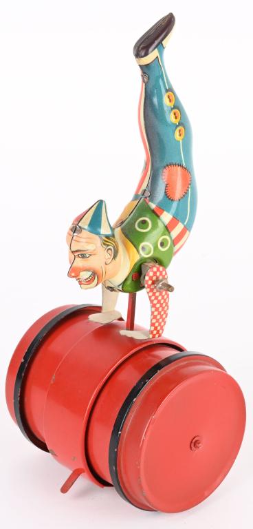 GERMAN TIN WINDUP CLOWN ON BARREL (1 of 5)