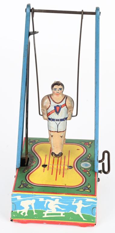 WYANDOTTE TIN WINDUP ACROBAT: All original and working. 9" Excellent