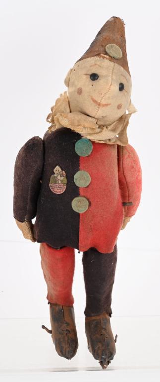 EARLY SCHUCO WINDUP CLOW ROLLER SKATER (1 of 4)