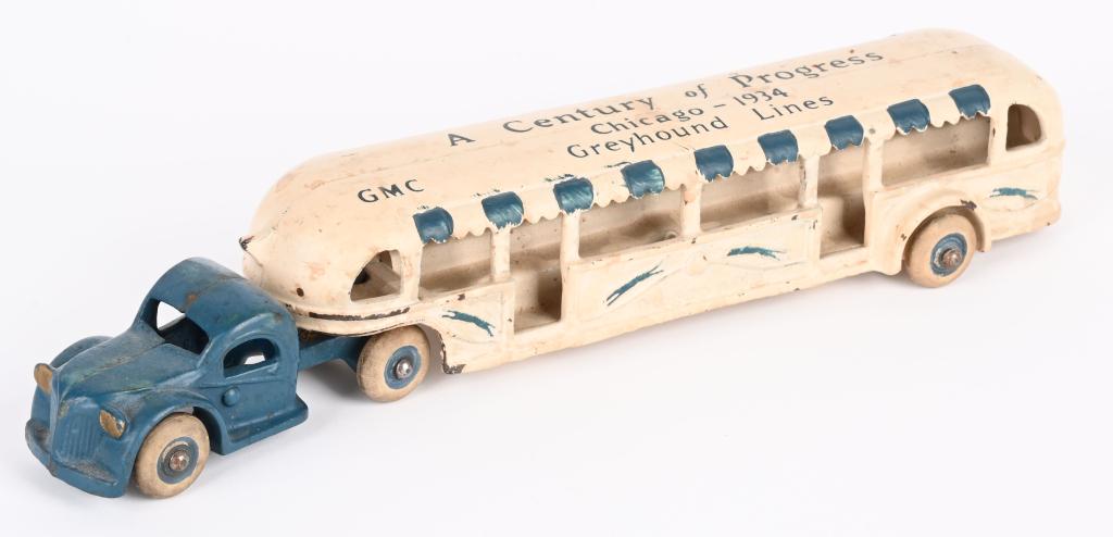 ARCADE CAST IRON 1934 WORLDS FAIR BUS, 11": Second largest size of this bus in original condition. No cracks or breaks, and retains Arcade sticker. 11" Excellent