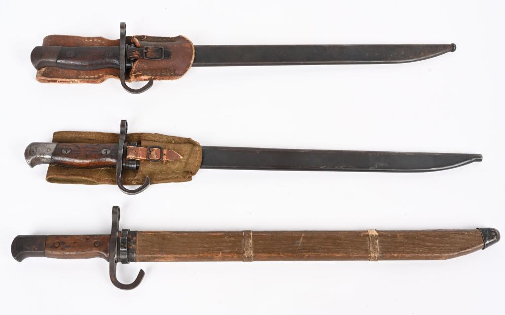 WWII JAPANESE BAYONET LOT OF THREE IJA WW2: WWII Japanese lot of bayonets to include 1) WWII JAPANESE INFANTRY TYPE 30 BAYONET W/ WOOD SCABBARD. Serial number to the head of the pommel. The pommel’s button functions perfectly. The contoured w