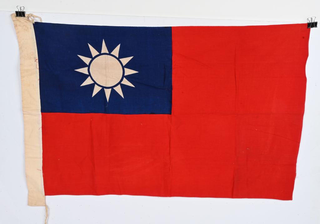 WWII LARGE FLAG OF THE TAIWAN REPUBLIC OF CHINA: A red field, with a blue canton containing a 12-ray white sun measuring 25 1/2 X 40 inches. Excellent