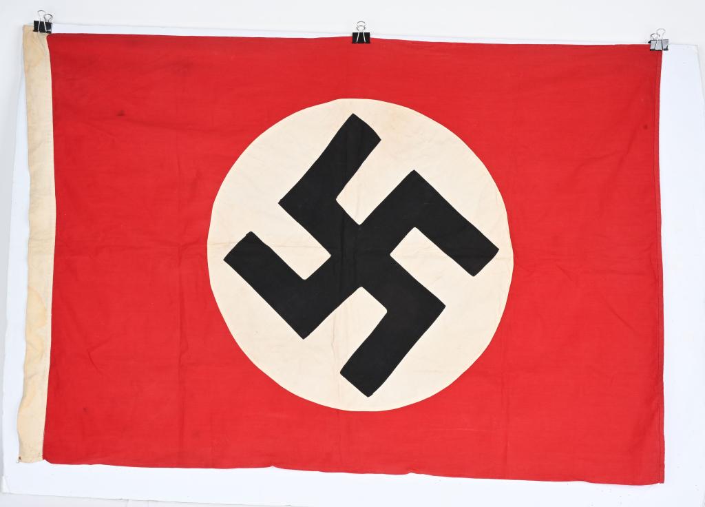 WWII NAZI GERMAN NSDAP FLAG 45X31 WW2: Multi-piece cotton construction banner approximately 45 X 31 inches. To both its red fields are sewn white disks, with a separately applied mobile swastikas in black. Very Good. Probably one of the mo
