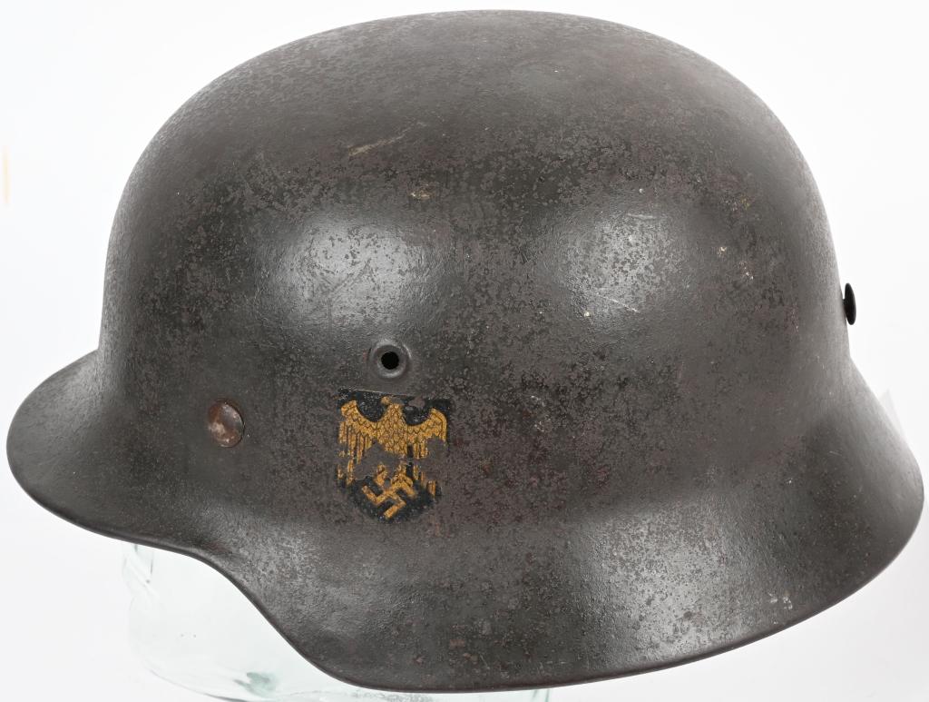 WWII NAZI GERMAN KRIEGSMARINE M40 SD HELMET WW2: The stamped sheet steel construction helmet retains about 80% of its original slightly rough textured green paint. The left side of the helmet has a Wehrmacht eagle shield decal featuring a deep golde
