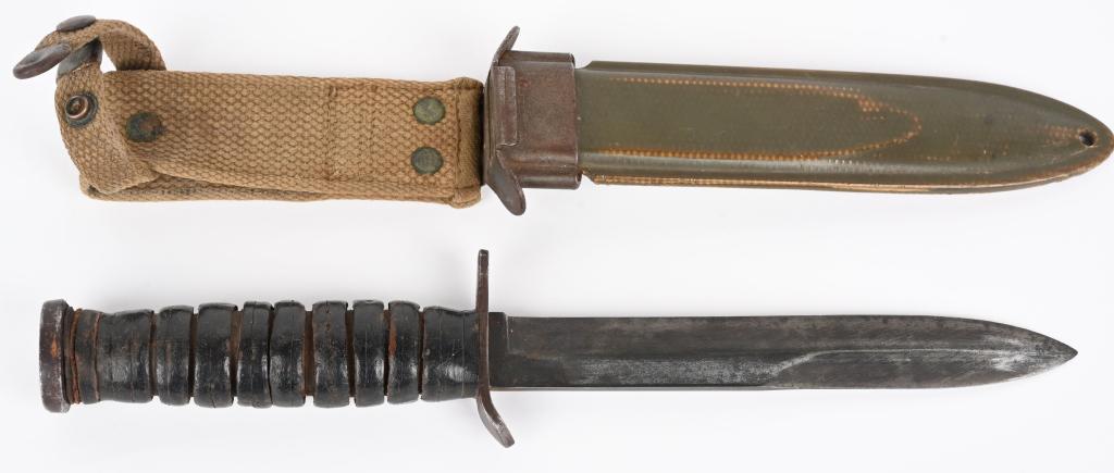 WWII US CASE GUARD MARKED M3 FIGHTING KNIFE: World War II US M3 fighting knife. Marked on the guard "USM3 CASE" with original US M8 scabbard. Blade and pommel show wear, as does the stacked leather washer handle. 6.5" blade, 11.5" overall length