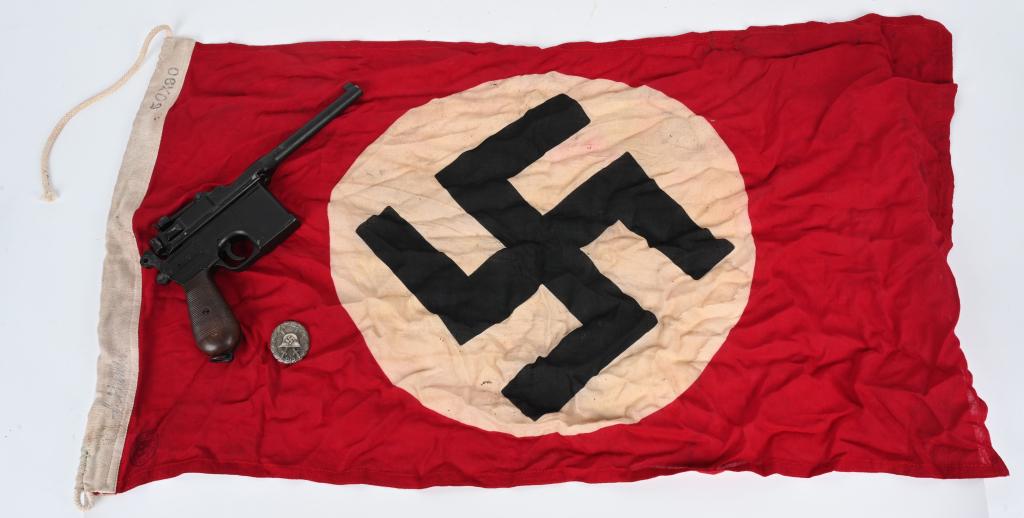 WWII NAZI GERMAN REPRO FLAG MAUSER PISTOL BADGE: WWII Reproduction lot to include 1) WWII Small NSDAP flag that is size marked 50X90 on the bunting in excellent condition 2) Denix WWII 1896 Mauser Broomhandle Replica Pistol Synthetic Grips in excell