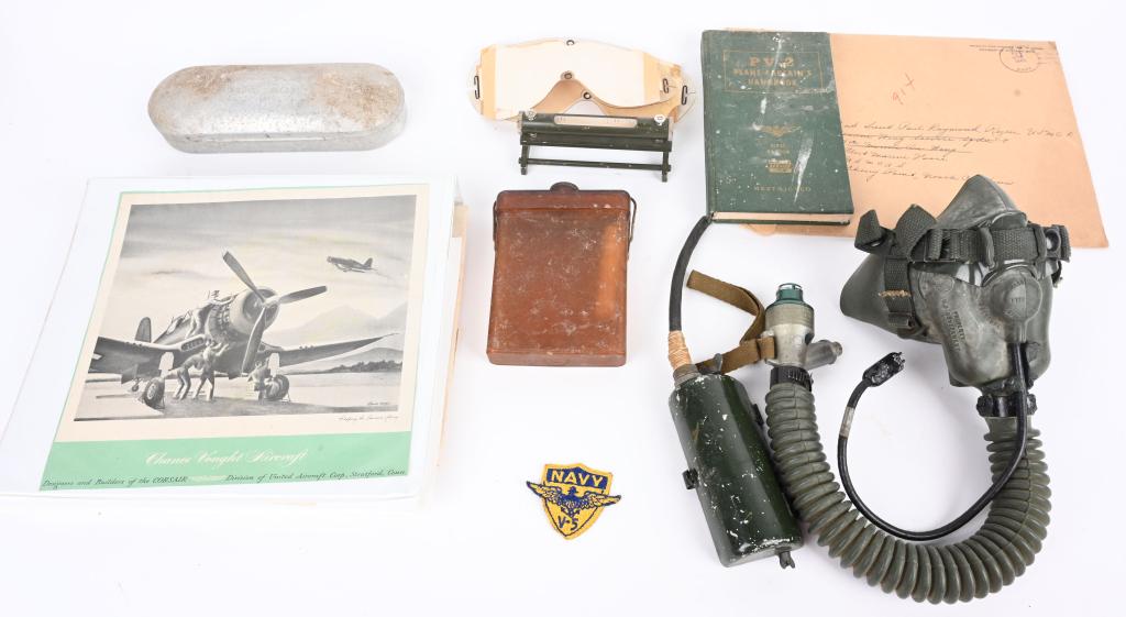 USMC AVIATOR GROUPING WWII THRU POST OXYGEN MASK: Collection of aviation items including 1) Type A13 oxygen mask that is still supple. 2) Personal effects of ephemera belonging to 2nd Lt. Paul Raymond Rezen USMCR including manuals and maps, Japanese