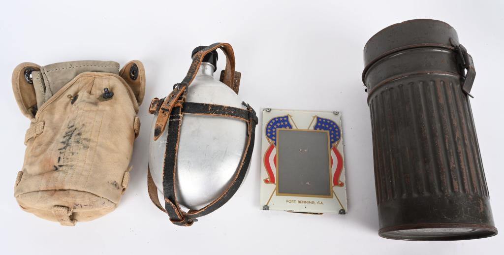 WW2 NAZI & US BOX LOT OF MILITARY CANTEEN GASKMASK: Military lot to include 1) 1935 US Cavalry canteen cover by J.Q.M.D in faded but otherwise good condition. 2) German gas mask M1930 with a canister for civil defense. 1938 mask 3) Standard issue, 1 1/