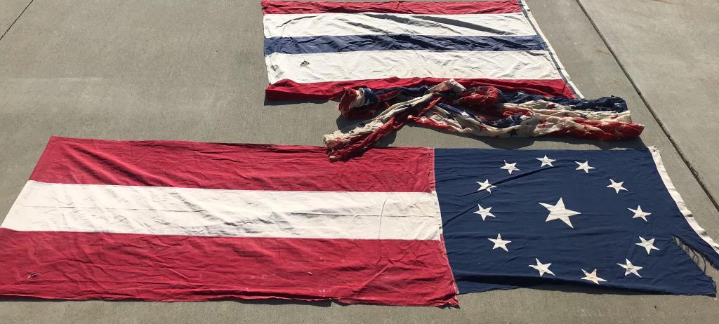 WWII US 5pc LOT AMERICAN PATRIOTIC BUNTING FLAGS: Five large World War II era US Red, White, and Blue flags. Includes a large blue stars & stripes banner measuring approximately 14' long and 30" wide; a Red, White, and Blue stars banner measuring app