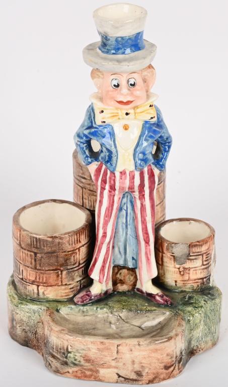 COX BROWNIE UNCLE SAM CIGAR & MATCH HOLDER: nice early Cox Brownie Uncle Sam Cigar and Match Holder. very nice colors. Has small chip to paint on match holder. Still displays great 8 1/2" Very Good-Excellent From the James and Helen Berkheimer 