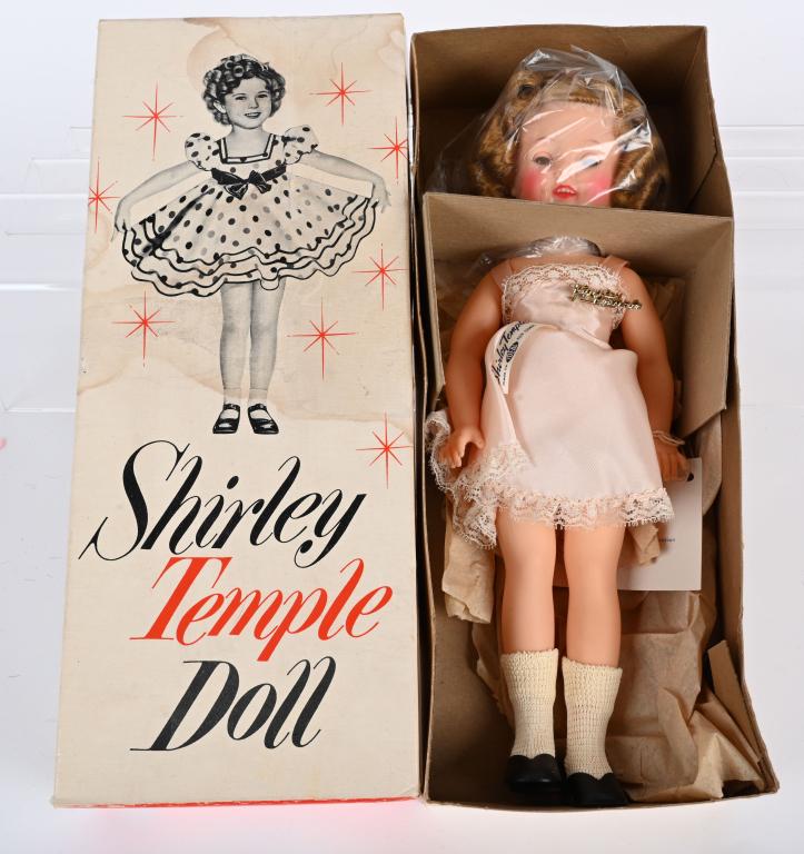 IDEAL 1950's SHIRLEY TEMPLE DOLL w/ BOX: The doll is all original with Shirley Temple pin, hang tag and box insert. The doll is 12" and looks to be unplayed with. The original box is complete but has some staining. Excellent From the James a