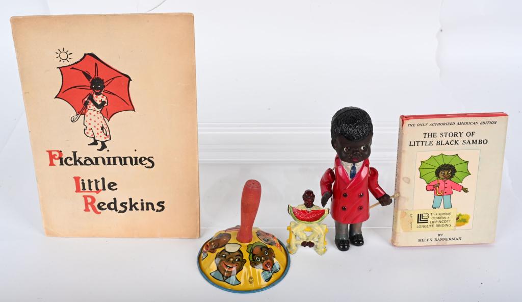 BLACK AMERICANA TOYS & BOOKS: Includes Celluloid Black Boy, Iron Man on Fence Eating Watermelon, Black Clown Noise Maker, little Black Sambo Book, and Pickaninnies Little Redskins Book. Largest 9 1/2" Excellent From the James and