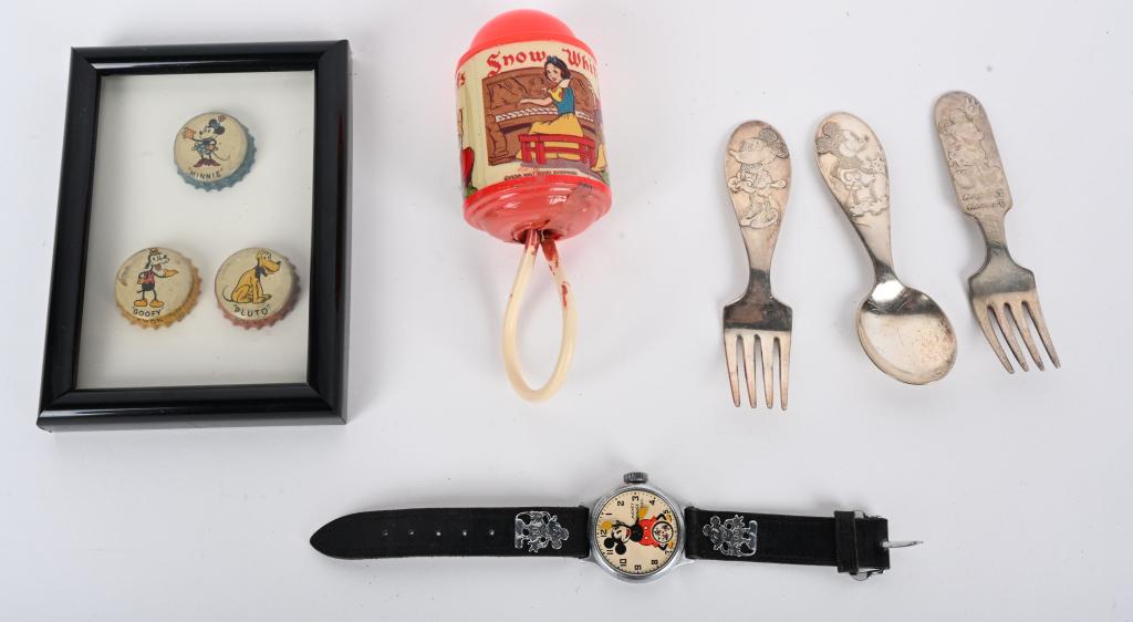 MICKEY MOUSE WATCH & MORE: Includes Mickey Mouse watch missing crystal and not working. Celluloid Snow White Rattle, Mickey Mouse Child's Silver ware, and Disney Bottle Caps. Largest 5" Excellent From the James and Helen Berkhe