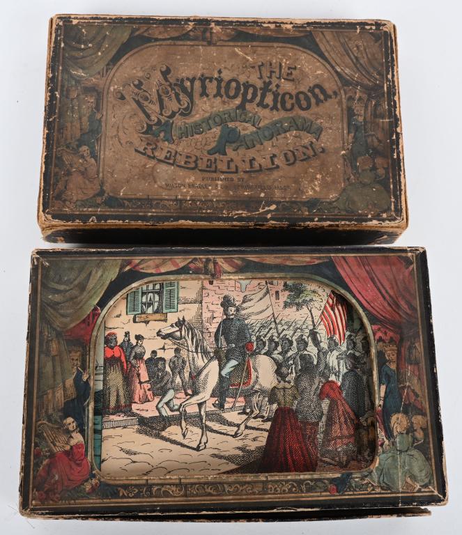 "THE MYRIOPTICON" HISTORICAL PANAORAMA REBELLION: "The Myriopticon" A Historical Panorama of the Rebellion. Made by Milton Bradley Co. Pair of reels showing scenes of the Civil War on what looks to be a stage. Use the key to roll the scenes along. Sc