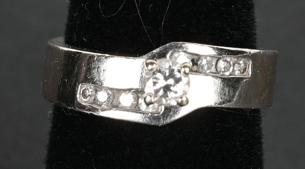 14K WHITE GOLD RING, .65 DIAMONDS SIZE 7 1/2: 14k Tim Allen Jewelry size 7 1/2 ring. Diamonds are .65 and wgt is 6.9 grams.