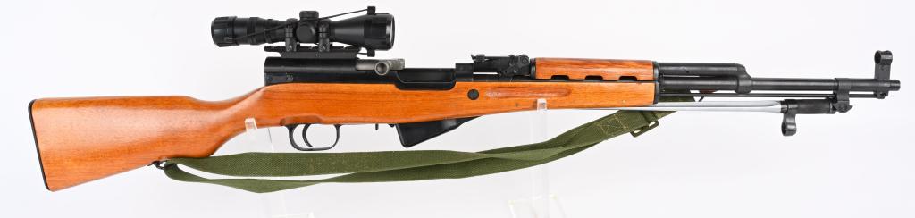 CHINES SKS RIFLE BY NORINCO WITH SCOPE: SERIAL NUMBER 9005511 BARREL 20" CALIBER 7.60X39 MANUFACTURED NORINCO. Produced in china with wood stocks and blue finished steel. Chrome line barrel with 10 round magazine. Folding bayonet and top co
