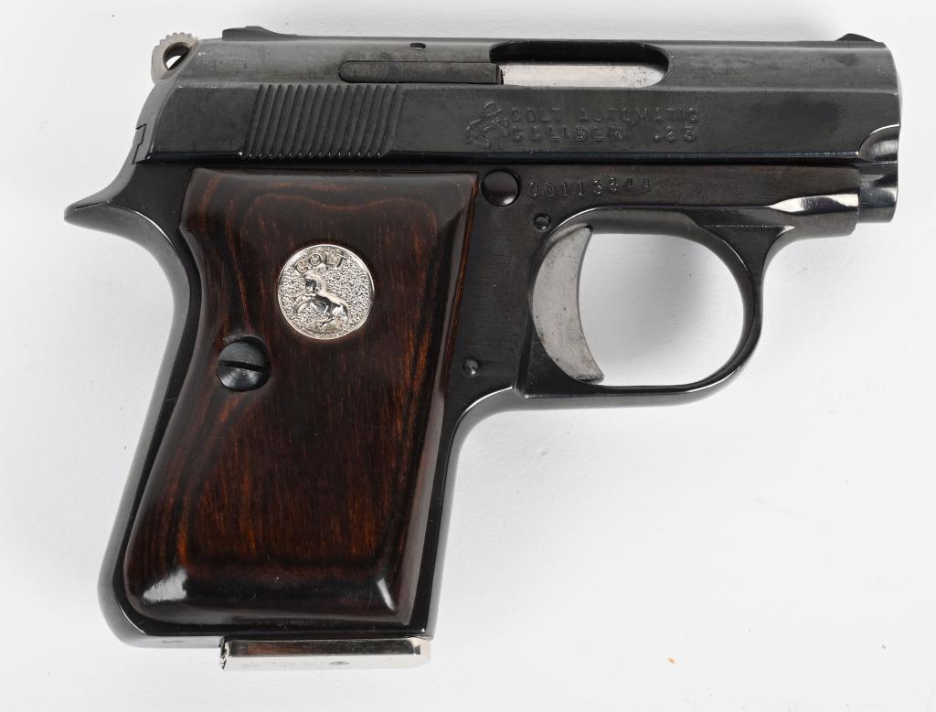COLT JUNIOR .25 AUTO PISTOL: SERIAL NUMBER OD113644 BARREL 2 1/4" CALIBER .25 ACP MANUFACTURED 1973. Assembled by Colt from imported Astra produced parts. Blue finish with single action exposed hammer action. Laminated wood grips