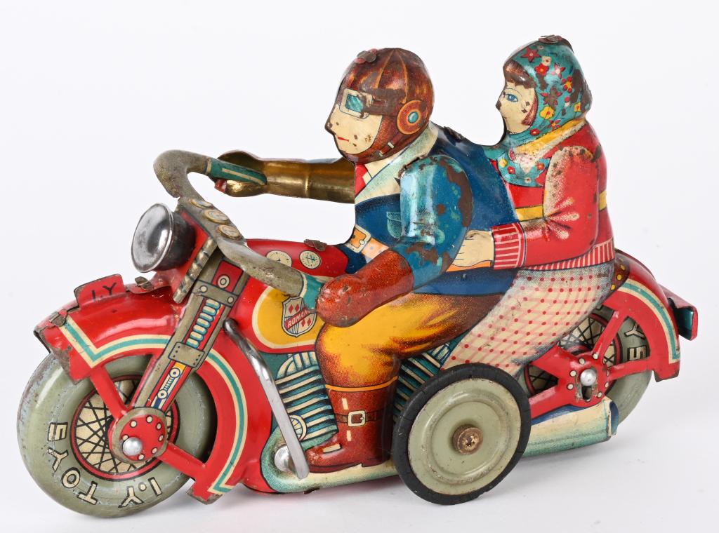 JAPAN TIN FRICTION ROMANCE MOTORCYCLE: Scarce Japan tin friction Romance Motorcycle. All original and complete. Bike has some play wear. Friction works. A very hard toy to find. 7" Very Good