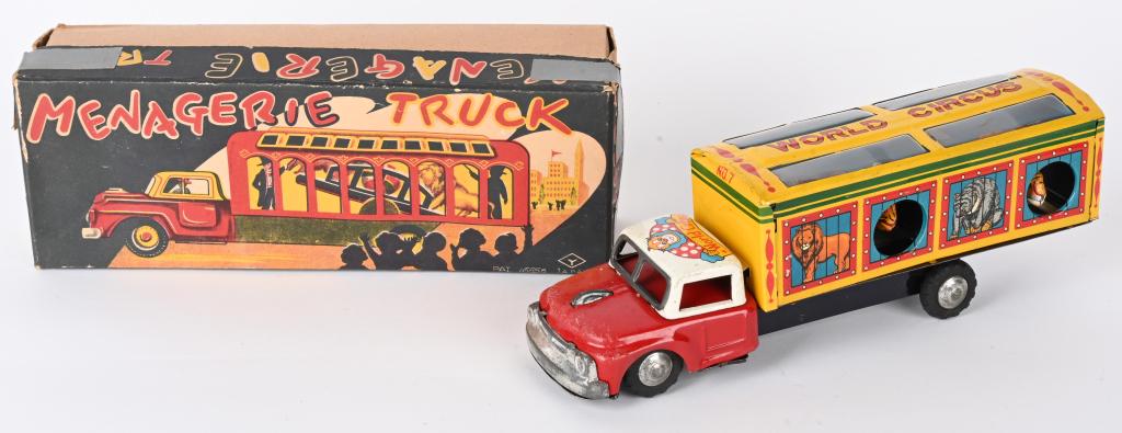 JAPAN TIN FRICTION MENAGERIE TRUCK w/ BOX: Japan tin friction Menagerie Truck. All original with great animal graphics and animals that pop out of the truck. Friction works. With Box. 10" Excellent