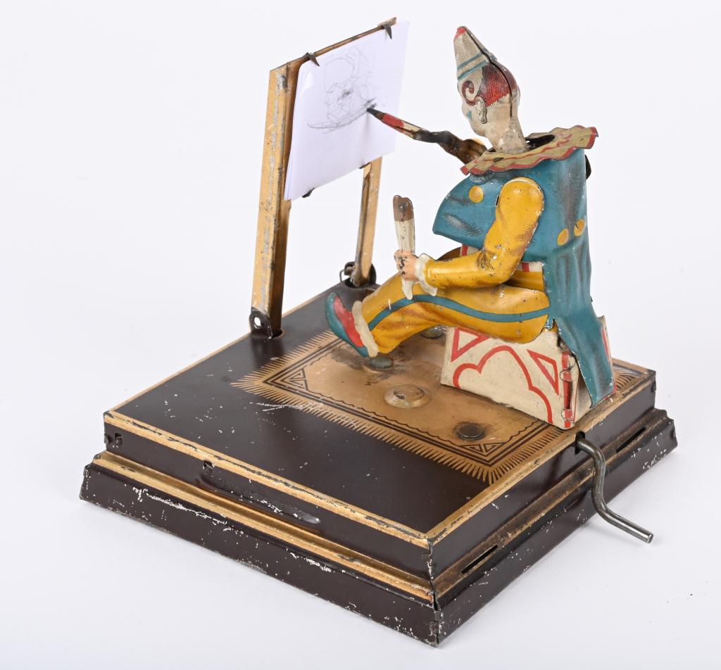 VIELMETTER CLOWN ARTIST TOY: RARE 1880s Vielmetter Clown Artist. All original beautiful toy. Was one of the most complicated toys of its time. Clown sits at easel and draws real pictures. You wind the crank to operate the Clown. 