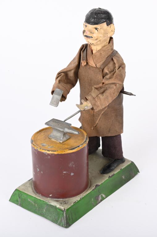 SCHOENNER TIN WINDUP BLACKSMITH (1 of 6)
