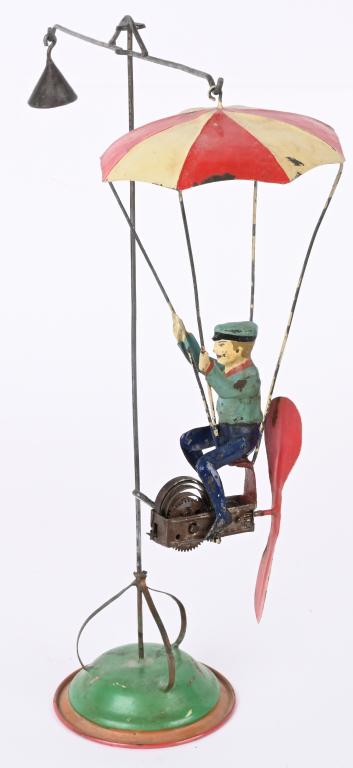 GERMAN TIN WINDUP FLYING PARACHUTE GO ROUND (1 of 7)