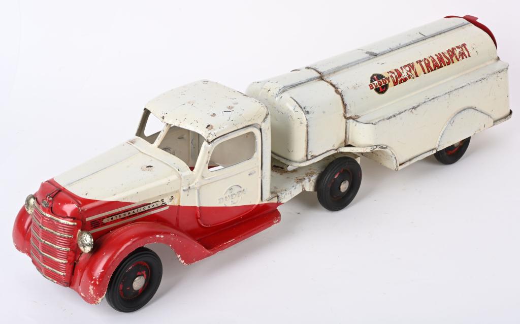 BUDDY L INTERNATIONAL DAIRY TRANSPORT TRUCK: Original Buddy L International Dairy Transport truck in red and white. All original except for rear door. A very Hard truck to find. 25", Very Good