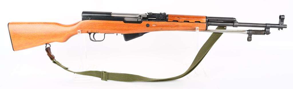 NORINCO CHINESE SKS RIFLE WITH SPIKE BAYONET: SERIAL NUMBER 24022151N BARREL 20" CALIBER 7.62X39 MANUFACTURED 1980'S. Produced in china for commercial sale in the United States. Deep gloss blue finished steel with lacquered Chinese hardwood stock