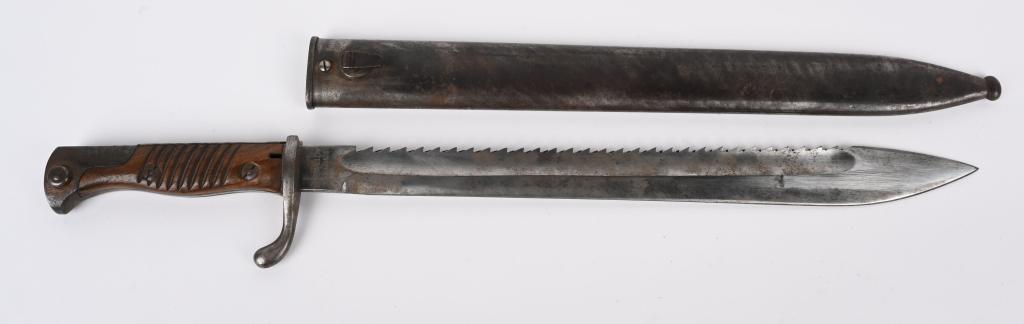 WWI IMPERIAL GERMAN M-1898/05 SAWBACK BAYONET: World War One German Sawback bayonet with steel scabbard. Stamped "Gebr. Hartkopf Solingen " on the obverse ricasso and "O. Dietrich Altenburg on the reverse ricasso. Both the14&1/2" blade and two pie