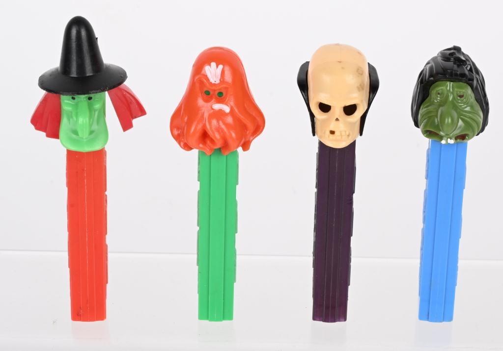 OCTOPUS, MR UGLY, SKULL, & WITCH PEZ DISPENSERS: Lot includes Octopus, Mr Ugly, Skull, and Witch Pez Dispensers. All no feet. Excellent