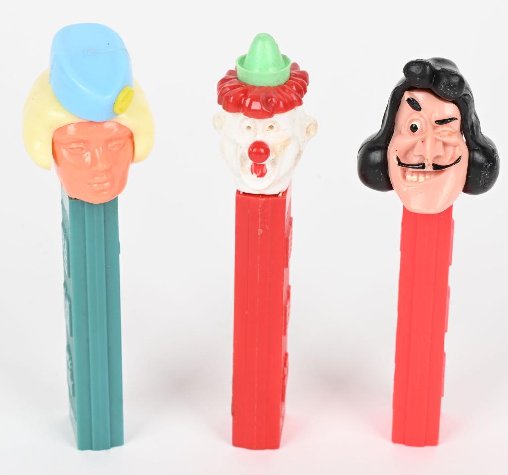 CLOWN, STEWARDESS, & CAPTAIN HOOK PEZ DISPENSERS: Includes Clown, Stewardess, and Captain Hook Pez Dispensers. All no feet. Excellent