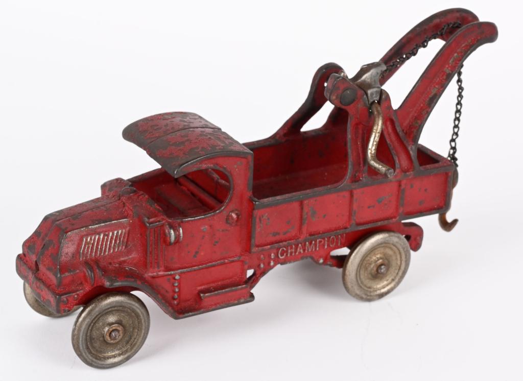 CHAMPION CAST IRON MACK TOW TRUCK: Original cast iron Champion Bulldog Mack Tow Truck. All original with small chip on cab thats possibly a casting flaw. Still has tow hook. 9" Very Good-Excellent