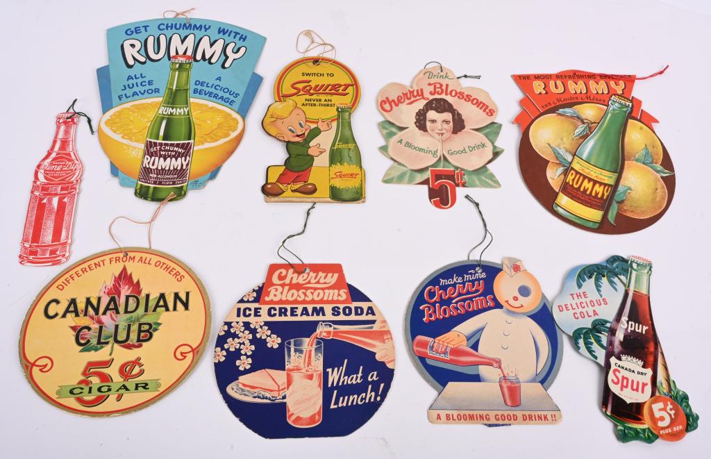 9- SODA POP CARDBOARD ADVERTISING FAN PULLS: Lot of cardboard advertising fan pulls. Includes Spur, Wine Dip, Squirt, Cherry Blossons, Rummy, and Canadian Club. 10 1/2" Excellent